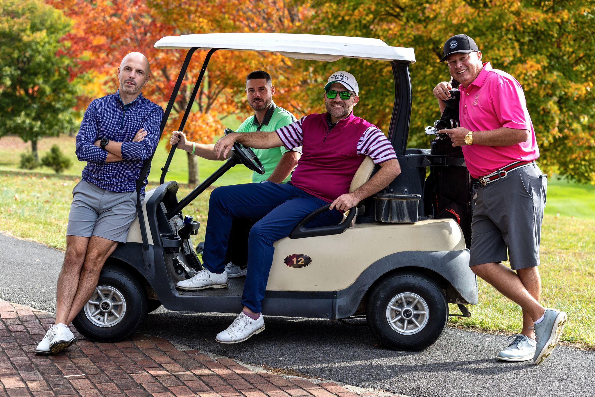 Golfers with a golf cart